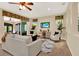 Bright living room with ceiling fan, lots of natural light and sliding glass doors to lanai at 1626 Victoria Gardens Drive, Deland, FL 32724