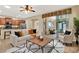 Open-concept living space with kitchen, living room and sliding doors for indoor-outdoor living at 1626 Victoria Gardens Drive, Deland, FL 32724
