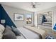 Bedroom featuring grey wood floors, large window, mirrored closet, and modern design at 1631 Long Ridge Ct # 268, Orlando, FL 32807