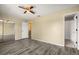 Bedroom showcasing gray wood floors, closet, a ceiling fan, and neutral walls at 1631 Long Ridge Ct # 268, Orlando, FL 32807