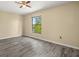 Bedroom with a view of a lake and light hardwood flooring at 1631 Long Ridge Ct # 268, Orlando, FL 32807