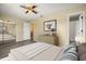 Bedroom with a ceiling fan, dresser, closet and bed at 1631 Long Ridge Ct # 268, Orlando, FL 32807
