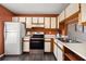 Well-appointed kitchen featuring stainless steel appliances, ample cabinet space, and stylish, dark flooring at 1631 Long Ridge Ct # 268, Orlando, FL 32807