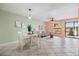 Open-concept living space with dining area and comfortable seating near the sliding glass doors at 1631 Long Ridge Ct # 268, Orlando, FL 32807