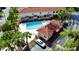 Aerial view of community pool, cabana and surrounding landscaping at 1631 Long Ridge Ct # 268, Orlando, FL 32807