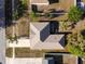An aerial view of the home shows the roof, landscaping, and surrounding neighborhood at 1632 Lansfield Ave, Deltona, FL 32738