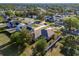 This aerial view showcases the house, its large yard, and the quiet, tree-lined neighborhood at 1632 Lansfield Ave, Deltona, FL 32738
