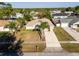 Charming single-story home with lush landscaping, a long driveway, and a two-car garage at 1632 Lansfield Ave, Deltona, FL 32738