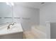 Relaxing bathroom featuring a double sink vanity and soaking tub at 1632 Lansfield Ave, Deltona, FL 32738