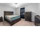 Cozy bedroom with dark wood furniture and a ceiling fan at 1632 Lansfield Ave, Deltona, FL 32738