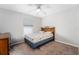 Cozy bedroom with neutral walls, ceiling fan, carpet flooring and a window that provides natural light at 1632 Lansfield Ave, Deltona, FL 32738