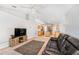 Comfortable living room with open view to the kitchen, featuring carpet and modern furniture at 1632 Lansfield Ave, Deltona, FL 32738