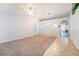 Spacious living room featuring tile floors, carpet, ample natural light, and a modern ceiling fan at 1632 Lansfield Ave, Deltona, FL 32738