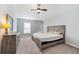 Spacious main bedroom with vaulted ceiling, ceiling fan, and carpeted floors at 1632 Lansfield Ave, Deltona, FL 32738