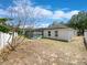 View of the home's backyard with screened in pool area and privacy fence at 1730 Lochshyre Loop, Ocoee, FL 34761