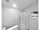 Bathroom featuring glass enclosed corner shower with built in shelves and natural light at 1730 Lochshyre Loop, Ocoee, FL 34761