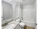 Bathroom with granite vanity, shower-tub combo, and built-in shelving at 1730 Lochshyre Loop, Ocoee, FL 34761