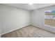 Cozy bedroom with soft carpet, a bright window, and neutral colored walls at 1730 Lochshyre Loop, Ocoee, FL 34761