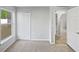 Bedroom featuring plush carpet, large window and closet at 1730 Lochshyre Loop, Ocoee, FL 34761