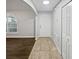 Inviting entryway featuring tile flooring and direct access to a living space with hardwood flooring at 1730 Lochshyre Loop, Ocoee, FL 34761