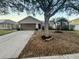 Charming single Gathering home boasts a two-car garage and inviting front yard at 1730 Lochshyre Loop, Ocoee, FL 34761