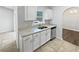 Bright kitchen featuring granite countertops, stainless steel dishwasher and white cabinets at 1730 Lochshyre Loop, Ocoee, FL 34761