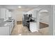 Modern kitchen with stainless steel appliances, sleek cabinets, and a tiled floor at 1730 Lochshyre Loop, Ocoee, FL 34761