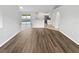 Spacious living room with attractive floors, light colored walls, and abundant natural light at 1730 Lochshyre Loop, Ocoee, FL 34761