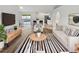 Bright living room featuring a comfortable seating arrangement, stylish decor, and sliding door to a patio at 1730 Lochshyre Loop, Ocoee, FL 34761