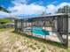 Screened-in pool and spa with patio offers a relaxing outdoor space at 1730 Lochshyre Loop, Ocoee, FL 34761
