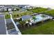 This aerial view shows the pool and surrounding community amenities, including lounge seating and covered cabanas at 18907 Rawson St, Orlando, FL 32827