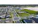 New home neighborhood showing houses and community pool, pier, and lake access for homeowners at 18907 Rawson St, Orlando, FL 32827