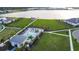 Aerial view of the community pool, lakeside pier and green space of the new home neighborhood at 18907 Rawson St, Orlando, FL 32827