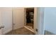 Attic access shows items stored in an unfinished room; access door is ajar at 18907 Rawson St, Orlando, FL 32827