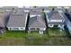 Aerial view of a home with a backyard featuring a covered patio and manicured lawn at 18907 Rawson St, Orlando, FL 32827
