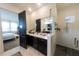 Bright bathroom featuring glass shower, bedroom access, and vanity at 18907 Rawson St, Orlando, FL 32827
