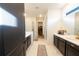 Bright bathroom featuring glass shower, open closet and vanity at 18907 Rawson St, Orlando, FL 32827