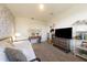 Bedroom featuring accent wall with floral design, with wooden furniture at 18907 Rawson St, Orlando, FL 32827