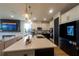 Modern kitchen with an island, stainless steel appliances and stylish pendant lighting at 18907 Rawson St, Orlando, FL 32827