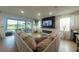 Spacious living room featuring a large couch and sliding glass doors at 18907 Rawson St, Orlando, FL 32827