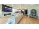 View of a spacious living area, a kitchen and a fireplace with a TV at 18907 Rawson St, Orlando, FL 32827