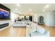 Open concept living area with views of kitchen and fireplace at 18907 Rawson St, Orlando, FL 32827