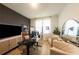 Bright home office with a large desk, comfortable seating, and ample natural light at 18907 Rawson St, Orlando, FL 32827