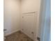 Small storage area with a white door and a neutral carpeted floor at 18907 Rawson St, Orlando, FL 32827