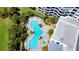 Amazing aerial view of the pool, the condo and its surrounding landscaping and foliage at 2 Oceans West Blvd # 2006, Daytona Beach Shores, FL 32118