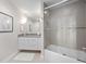 Bathroom featuring granite countertop, bath tub and shower, and modern decor at 2 Oceans West Blvd # 2006, Daytona Beach Shores, FL 32118
