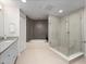 Bathroom featuring a glass shower and soaking tub at 2 Oceans West Blvd # 2006, Daytona Beach Shores, FL 32118