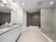 Modern bathroom with double vanity, soaking tub, and walk-in shower at 2 Oceans West Blvd # 2006, Daytona Beach Shores, FL 32118