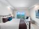 Bright bedroom with tray ceiling offers a waterfront view, stylish decor and natural light at 2 Oceans West Blvd # 2006, Daytona Beach Shores, FL 32118
