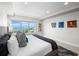 Bright bedroom with carpet offers water view and brightly colored modern decor at 2 Oceans West Blvd # 2006, Daytona Beach Shores, FL 32118